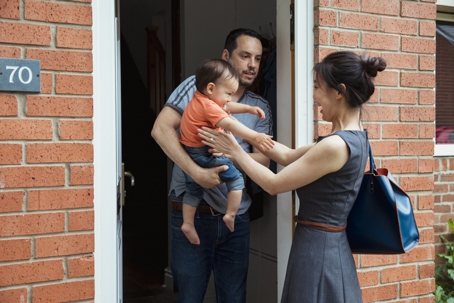 Son going to mother from dad's arms