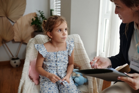 Social worker talking to a child