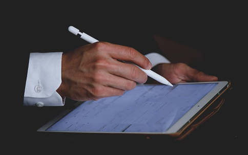 a man working on a tablet.