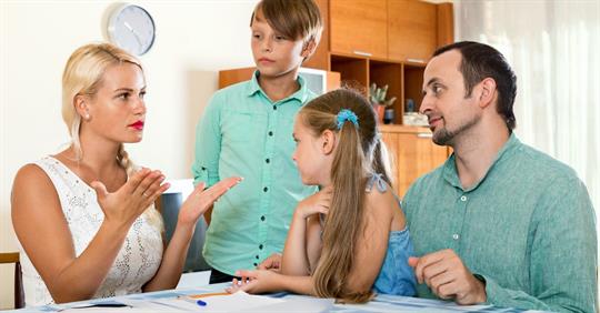 parents having tough conversation with two children